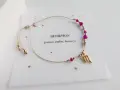 Bransoletka dla Skorpiona z hematytem, rubinem i granatem. Złoty symbol Skorpiona i regulowane zapięcie.