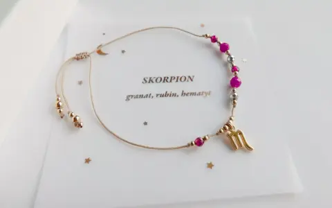 Bransoletka dla Skorpiona z hematytem, rubinem i granatem. Złoty symbol Skorpiona i regulowane zapięcie.